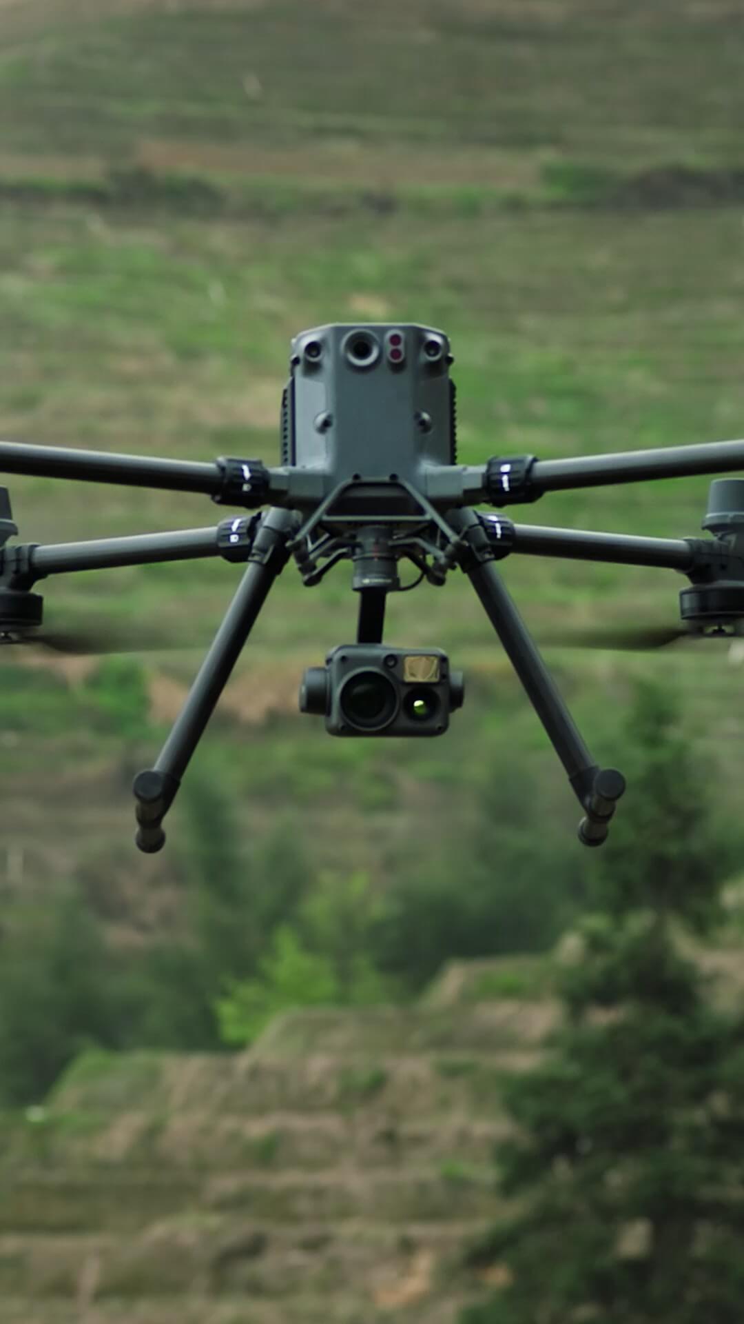 DJI Matrice 350 RTK enterprise drone flying over rugged terrain